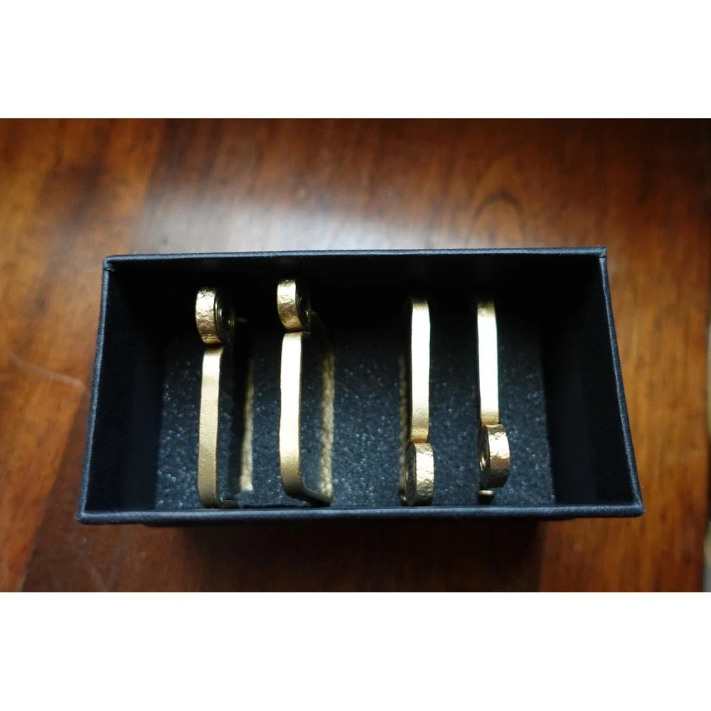 set of 4 Vintage napkin rings metal brass with swirl rectangular design